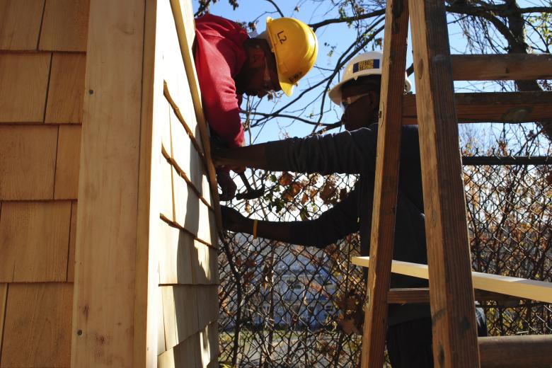 Students building a community shed.