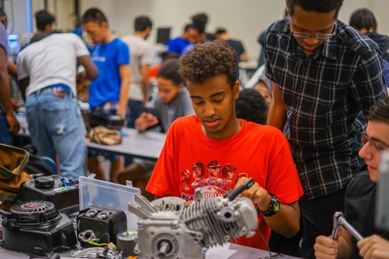 RAMP students building a small engine.