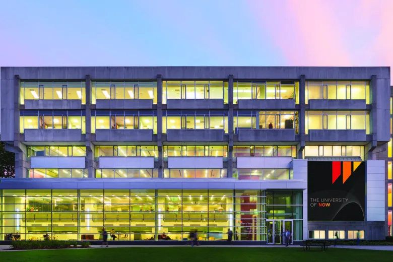A mockup of Beatty Hall with a newly branding sign on the right side of the building. 