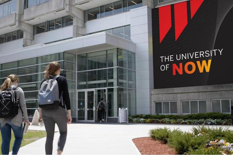 Students walking into building