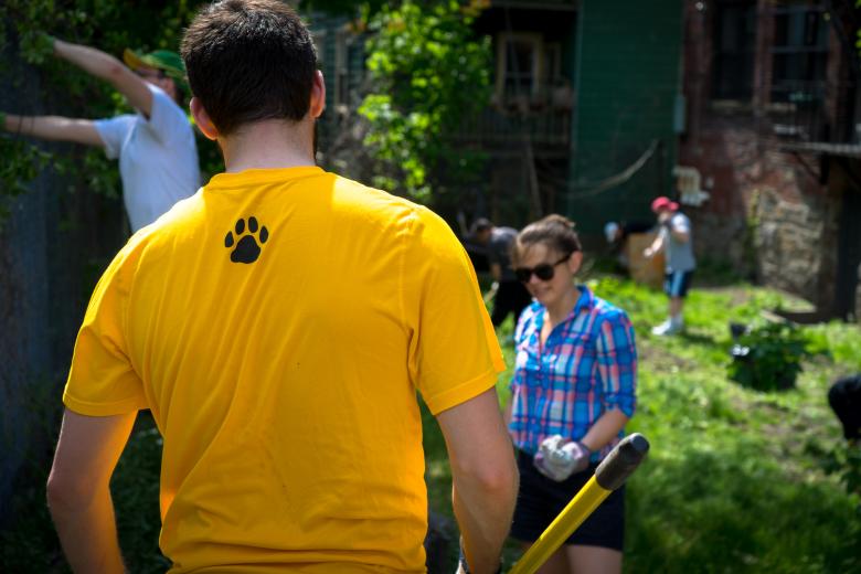 Faculty and staff volunteering to build a local community garden.