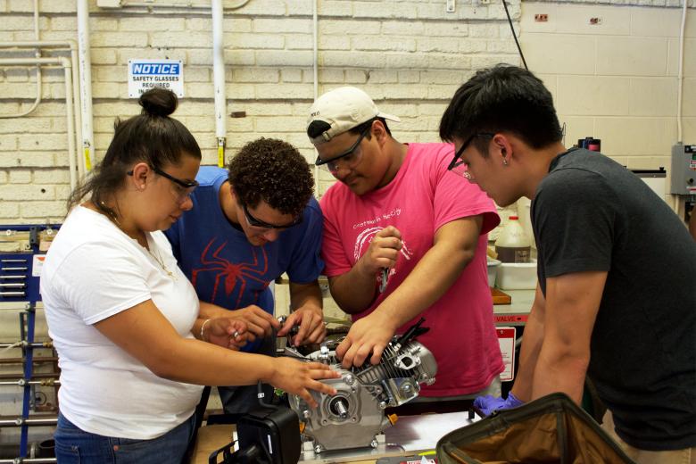 RAMP student building a small engine.