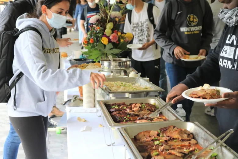Students getting food at a buffet