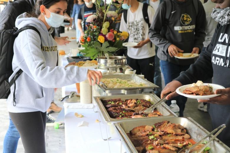 Students getting food at a buffet