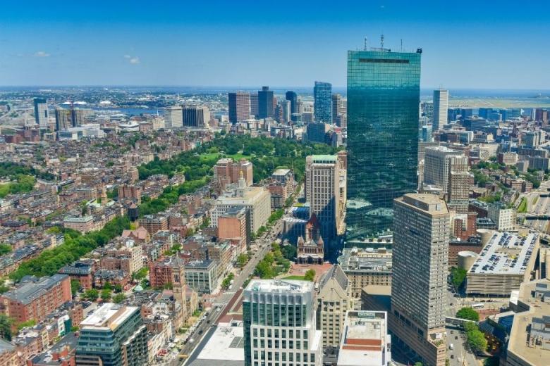 aerial shot of a city with tall buildings