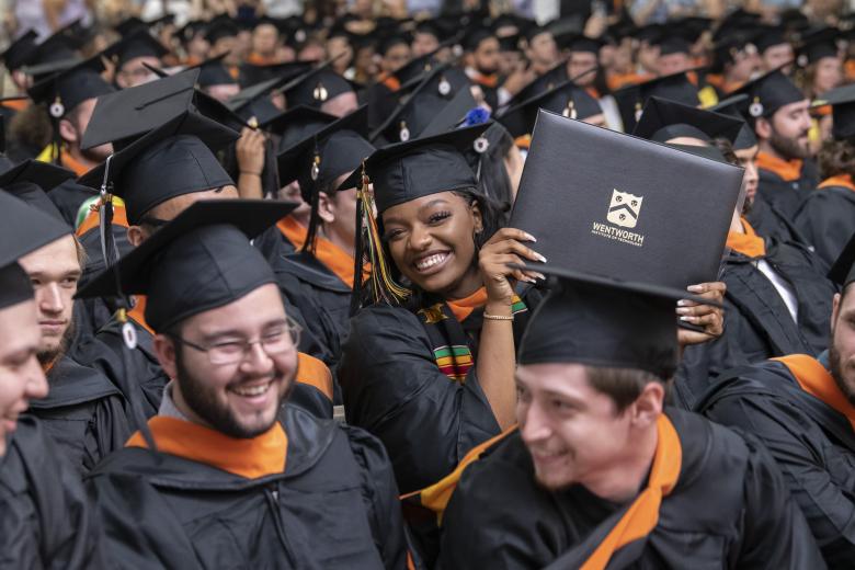 students wearing graduation caps and gowns