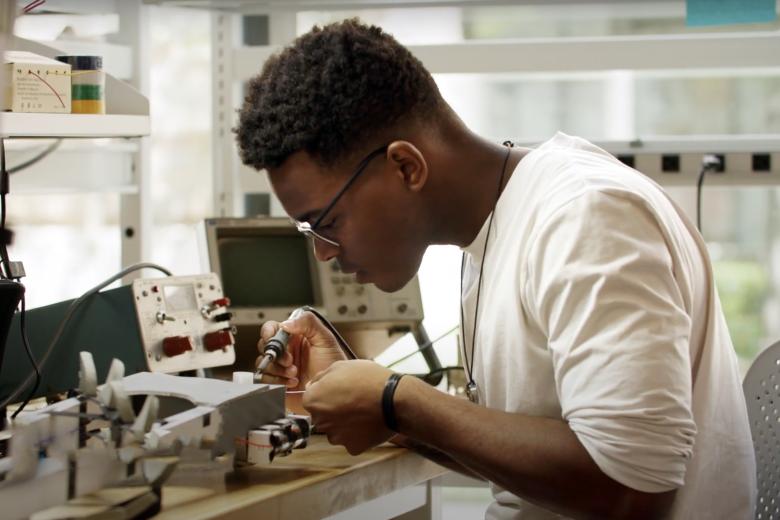 a man works on lab equipment