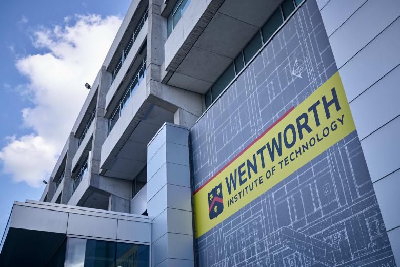 Wentworth sign on a campus building in daylight.