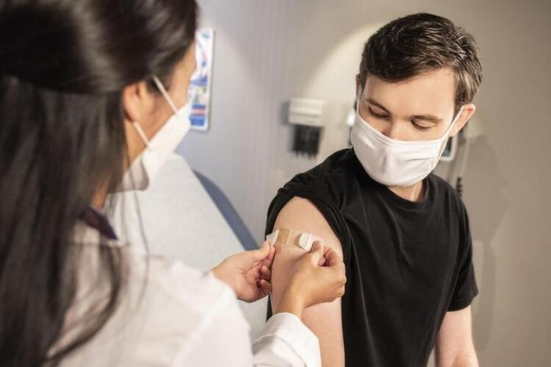 man getting vaccine shot