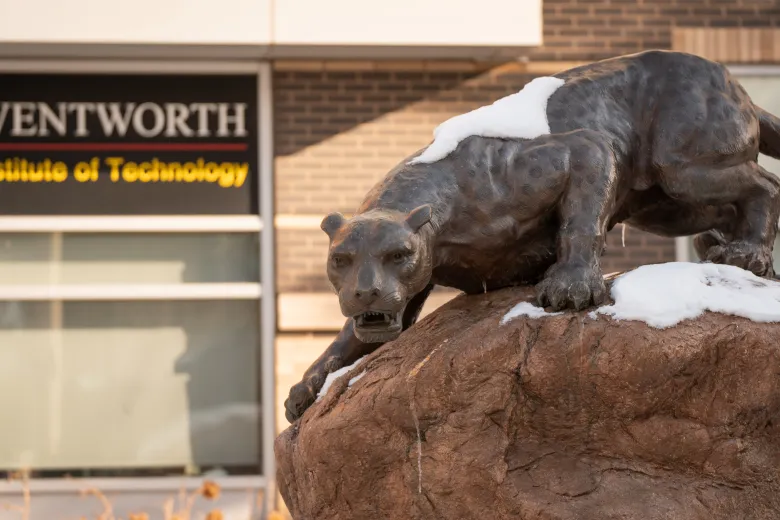 leopard statue covered in snow 