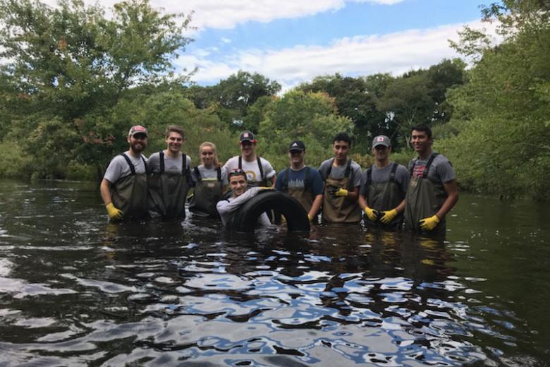 Gautham Das and students cleaning the Neponset River, one of the more satisfying events that I organized for the students. 100 rubber tires were pulled out of the river in 4 hours. 