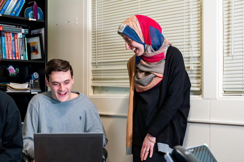 Afsaneh Ghanavati works with an engineering student on a problem in her office