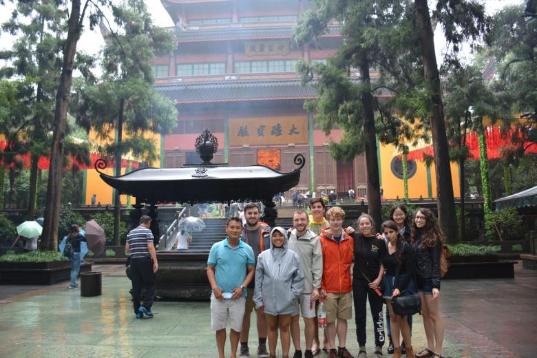A group of students pose outside a historic site in Shanghai, China