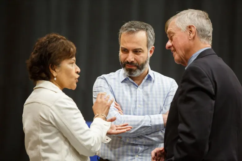 three wentworth employees conversing