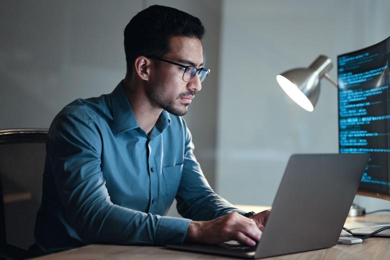 man programming on computer