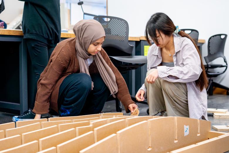 Two students working on build project in SummerFAB