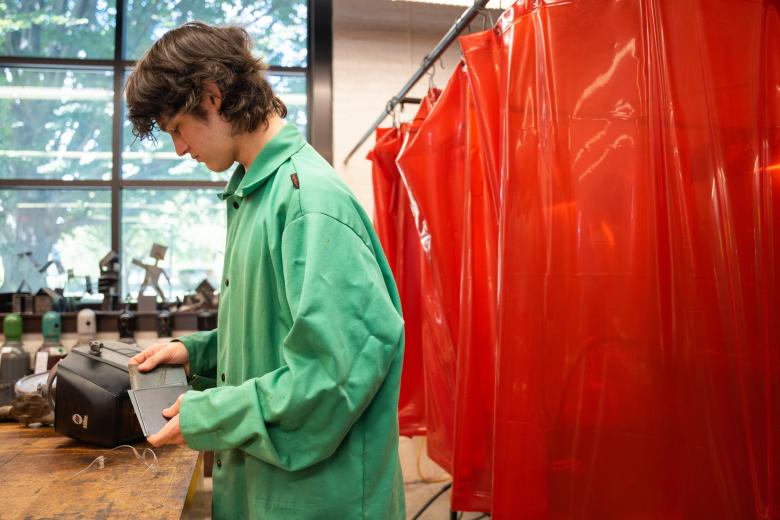 Student in welding lab space
