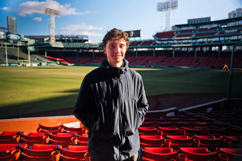 Sam Goy standing in Fenway Park