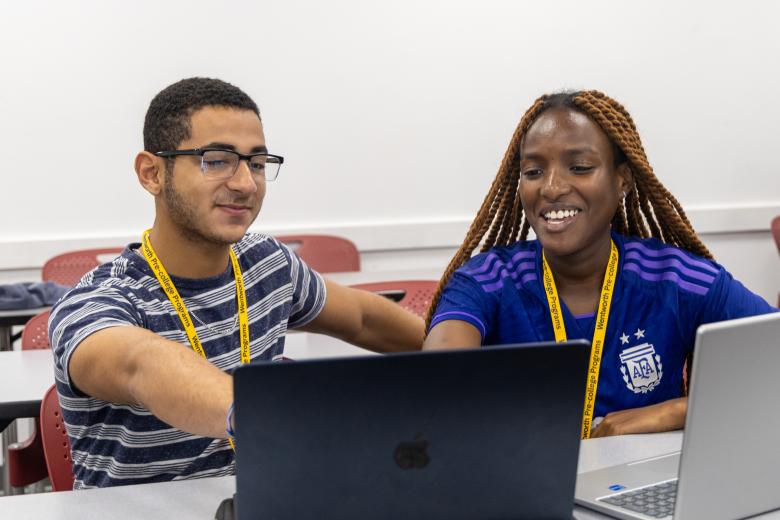 Two students looking at a computer screen
