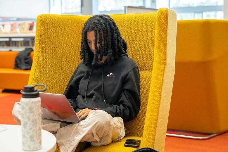 Student uses her laptop.