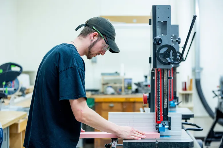 Student working with machinery