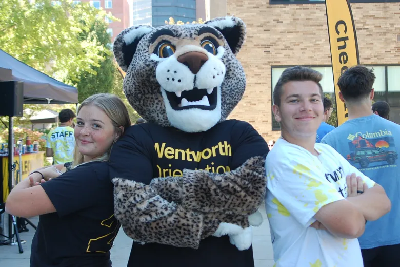 two students with Ruggles mascot