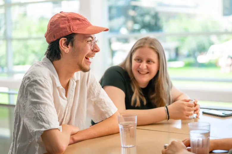 Students looking at each other and laughing 