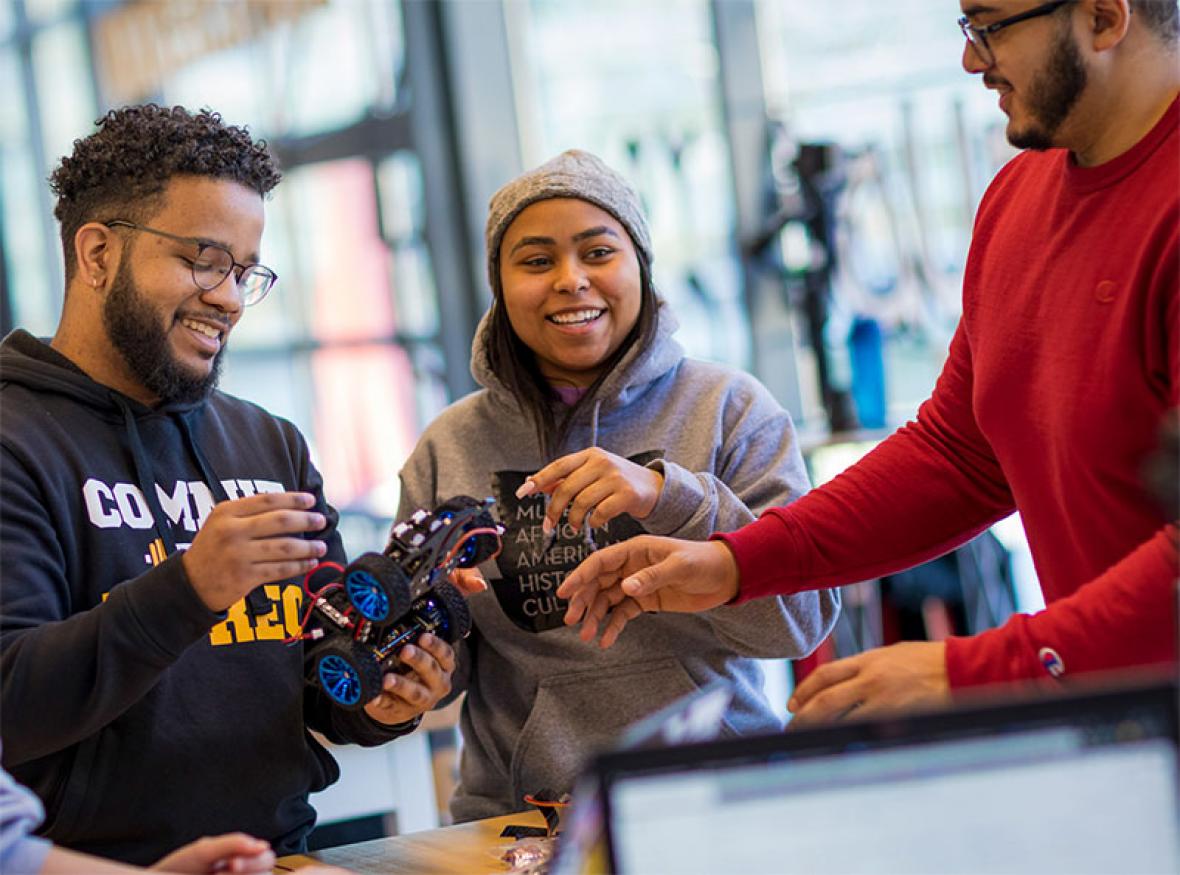 Students collaborate on a robotics project.