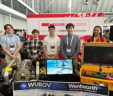 a team of students displaying an underwater robot