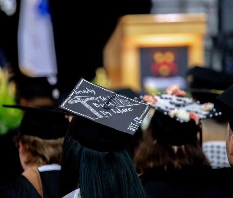 back of the head of a person wearing a graduation cap