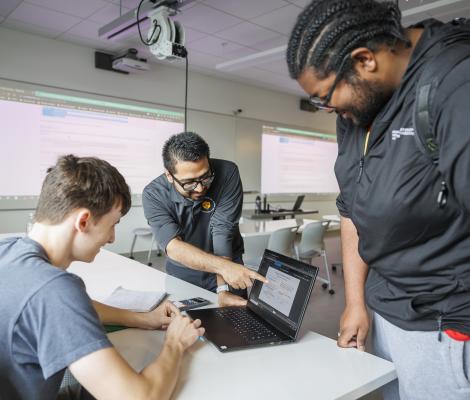 a group of students working on computers