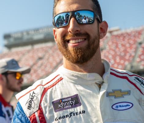 portrait of a man in a racing outfit