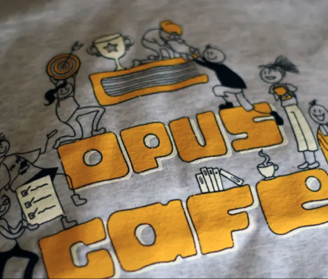 a t-shirt with the words "opus cafe"