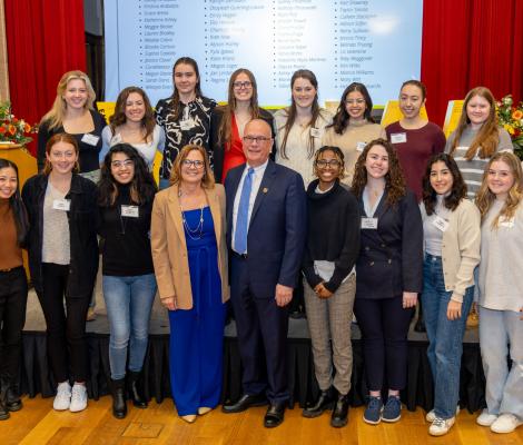 a large group of people posing for the camera