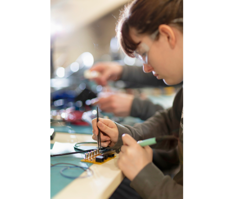 a woman working on a computer engineering project