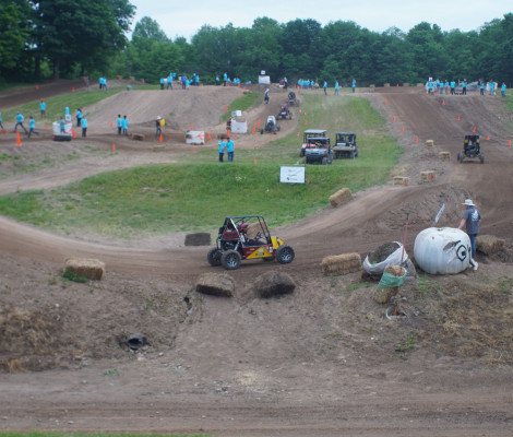 a dirt track featuring a buggy racing vehicle