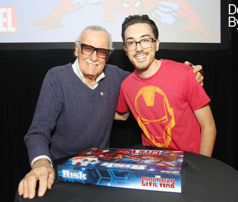 two men pose with a board game