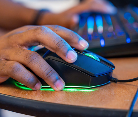 a hand on a computer mouse