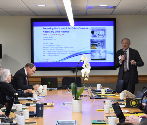 a group of people in a conference room