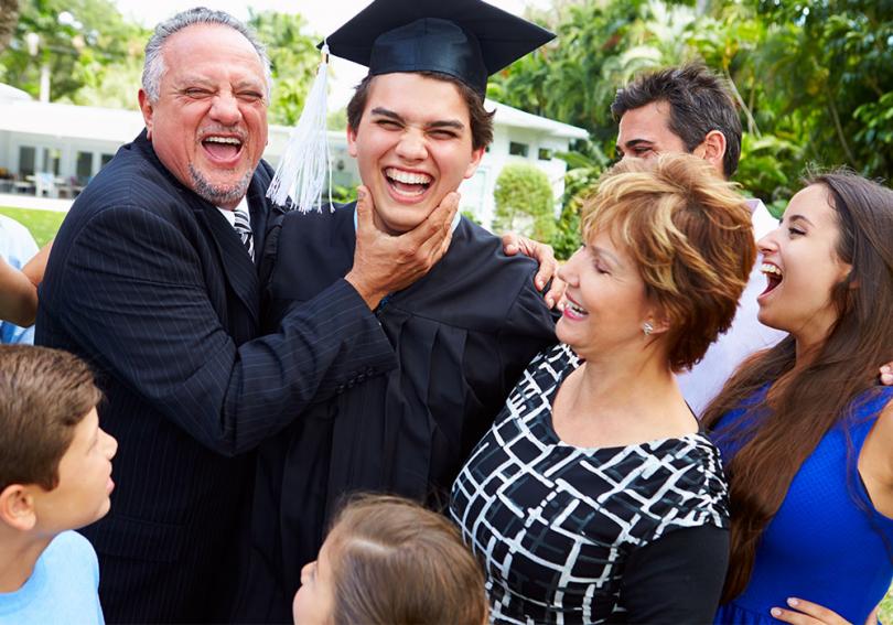 Hispanic family celebrating graduation.