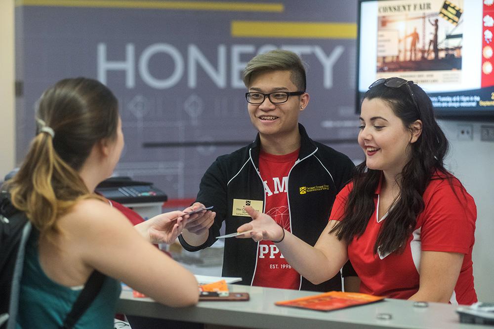 Students getting assistance at the Flanagan Center Info Hub.