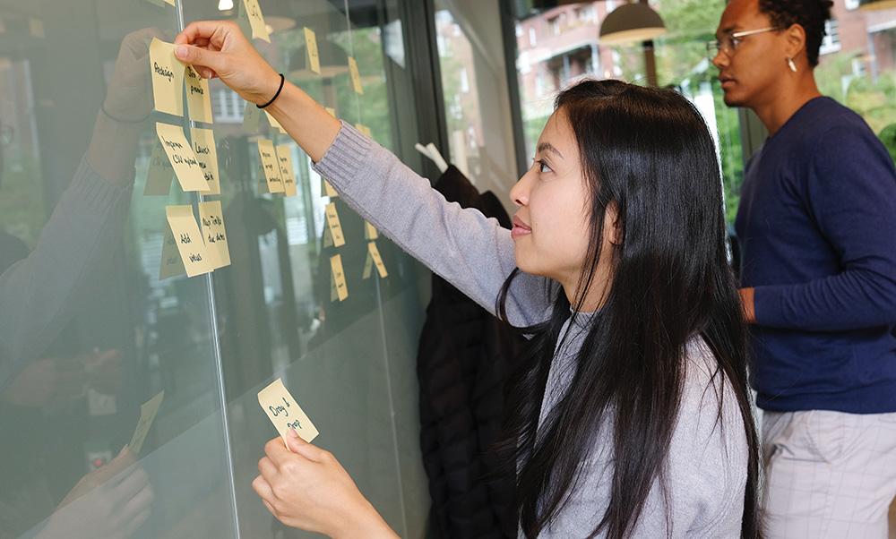 Students posting notes on Kanban board. <span>Photo by <a href="https://unsplash.com/@airfocus?utm_source=unsplash&utm_medium=referral&utm_content=creditCopyText">airfocus</a> on <a href="https://unsplash.com/s/photos/management?utm_source=unsplash&utm_medium=referral&utm_content=creditCopyText">Unsplash</a></span>