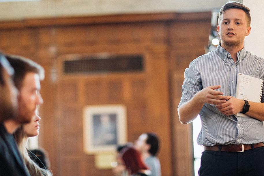 Graduate student makes final presentation to peers.