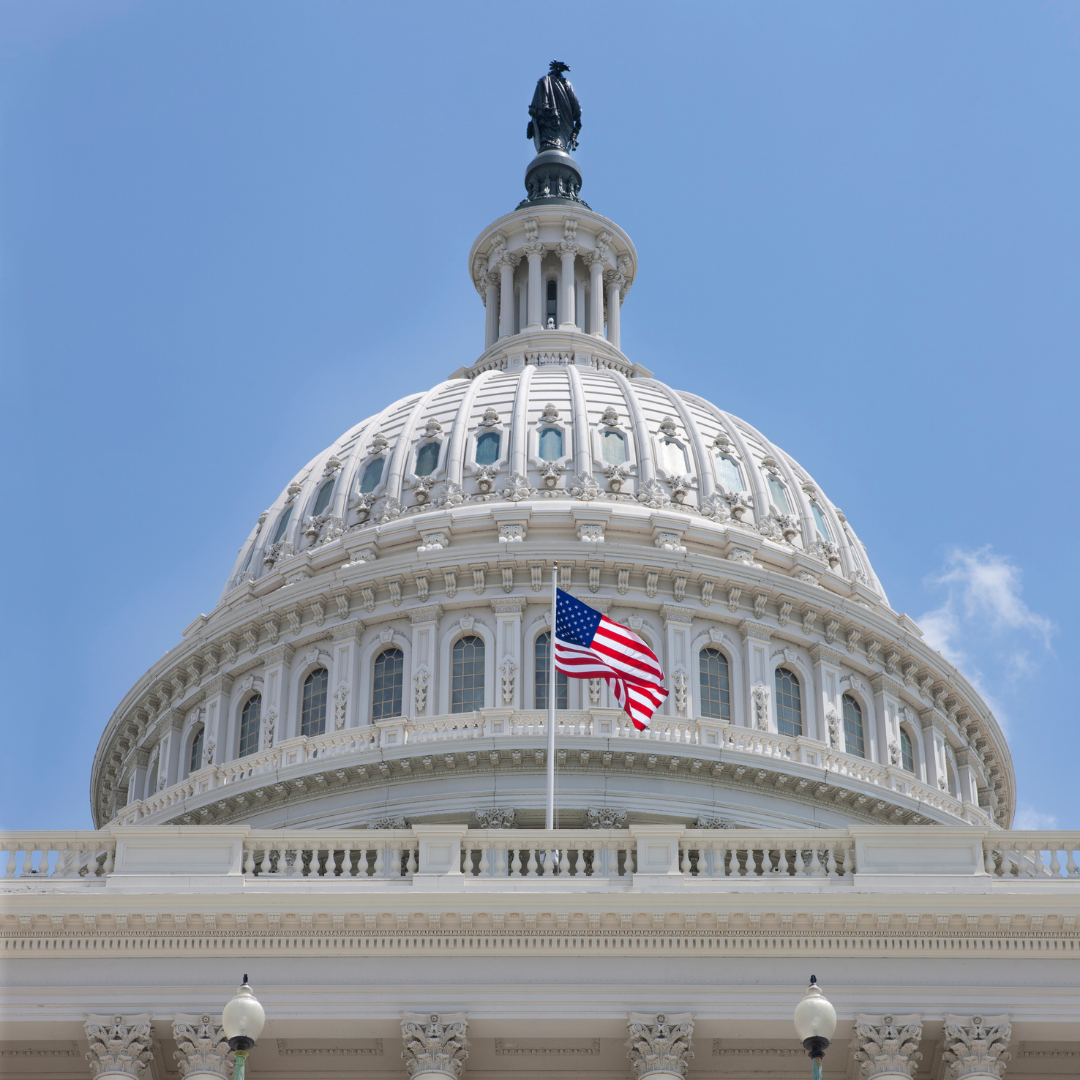 american flag outside the united states capitol building