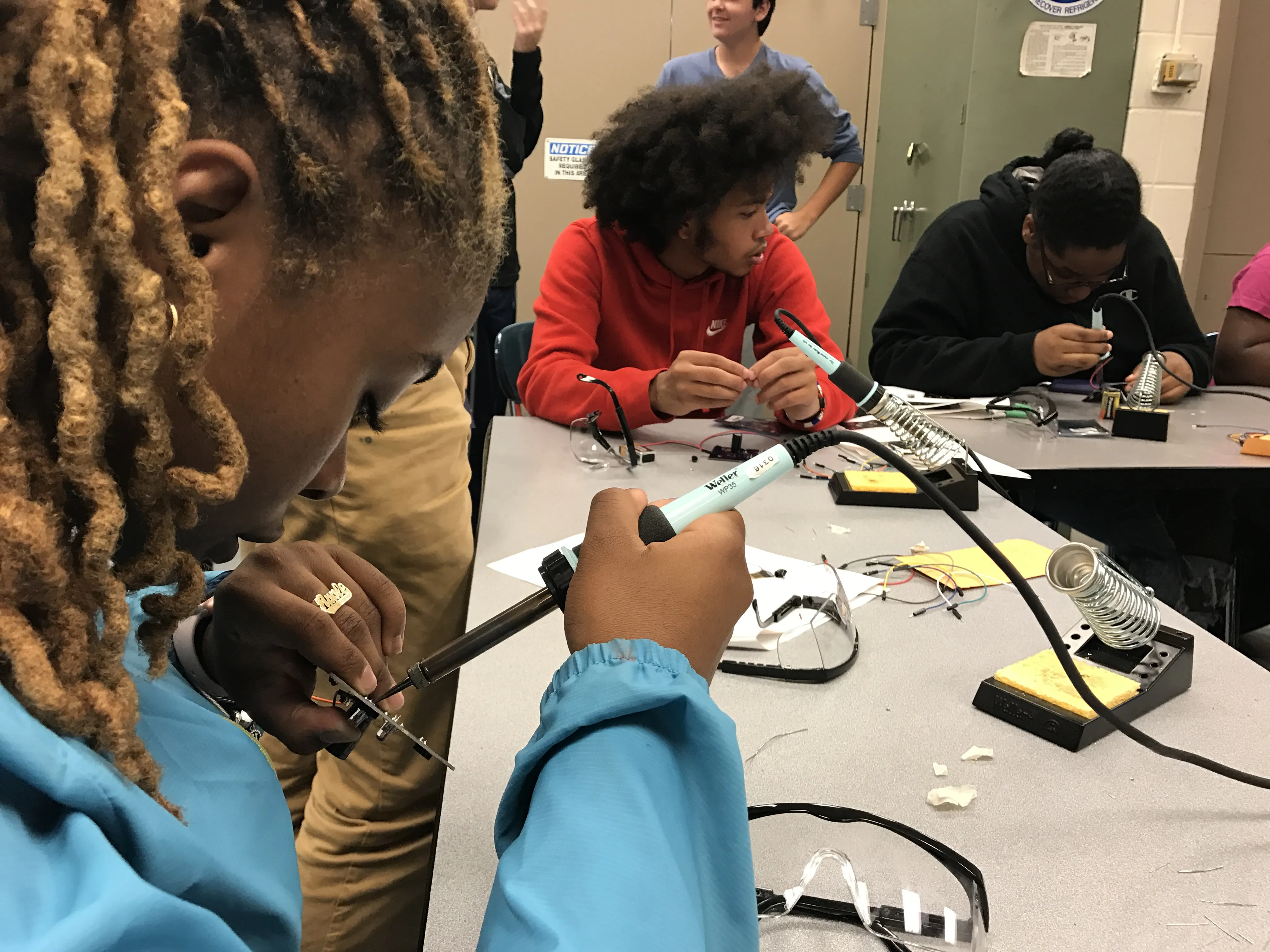 Students building circuits in a lab.