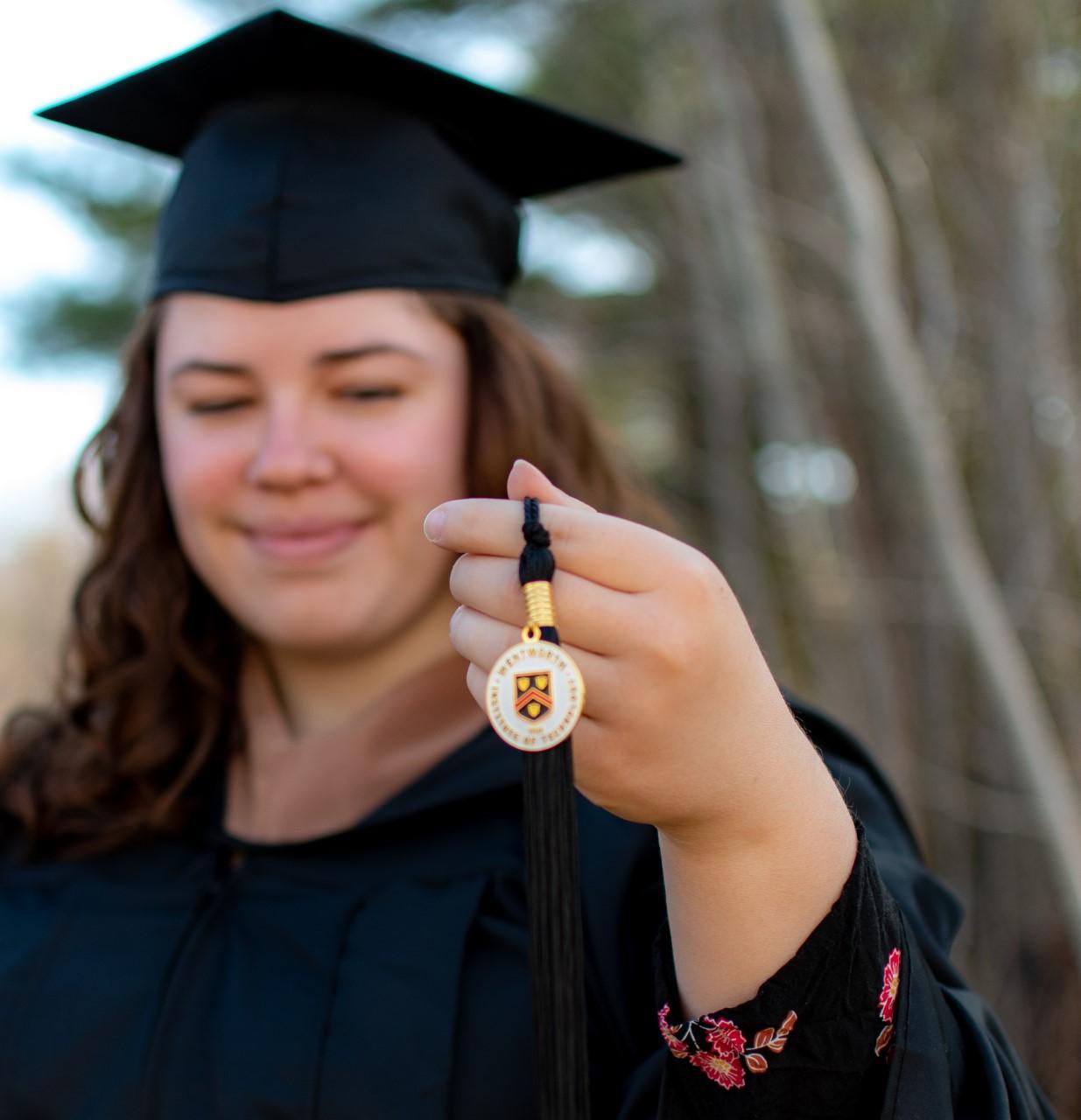 portrait of a woman holding a medallion