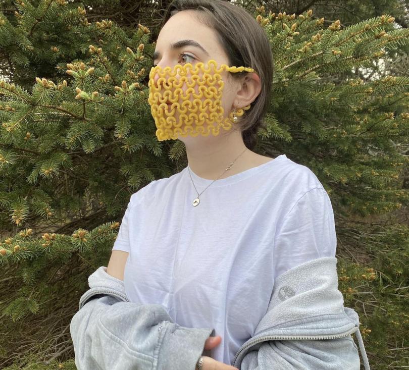woman wears mask made of pasta