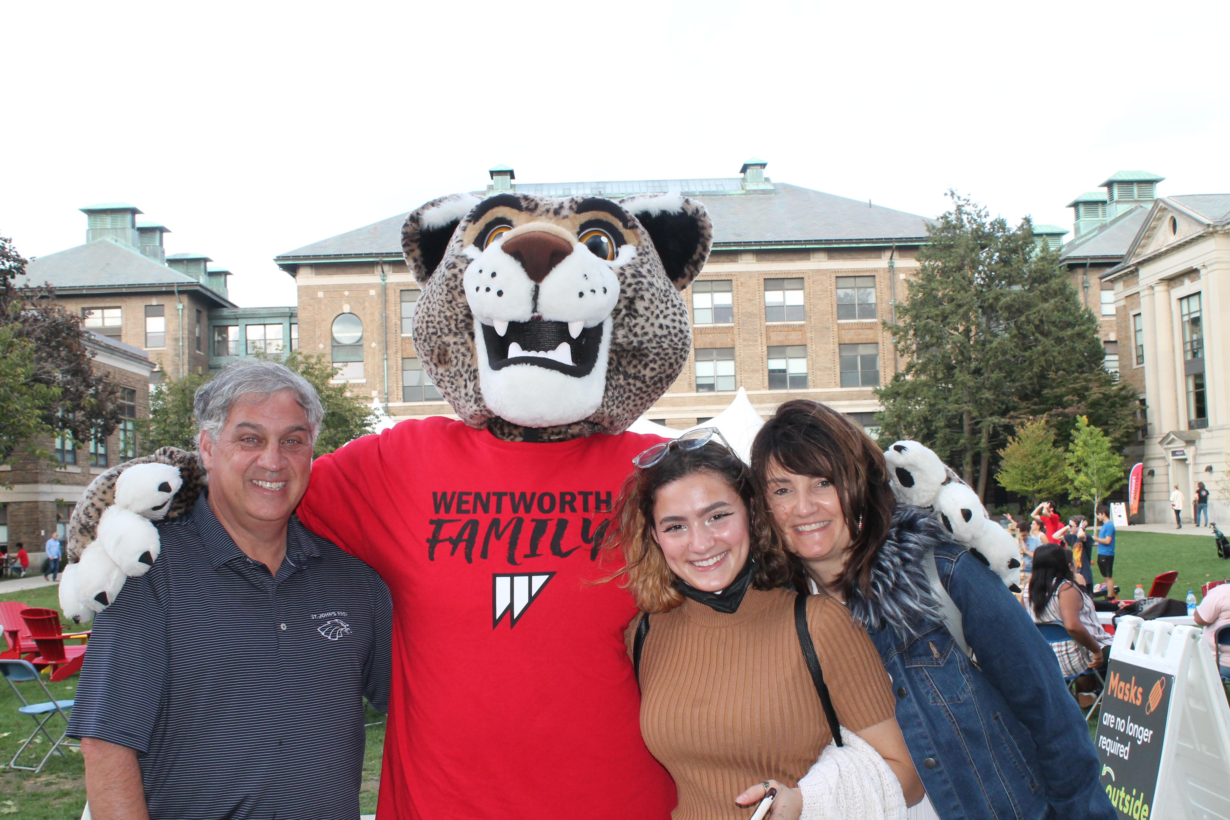 Family poses with leopard mascot