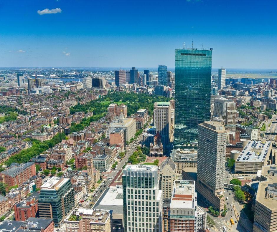 aerial shot of a city with tall buildings