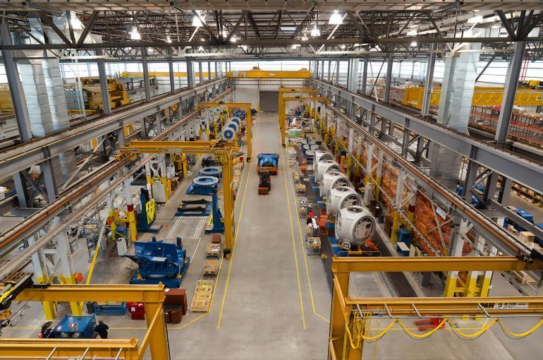A large warehouse facility with big machinery inside